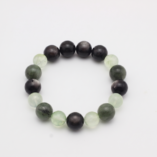 Aqua Verdance bracelet by Krysora - Silver Sheen Obsidian, Green Rutilated Quartz and Prehnite beads, cool ink and fresh sage palette, product photo on white background