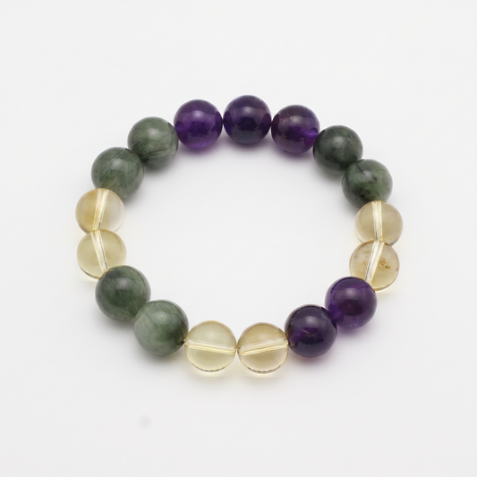 Verdant Flame bracelet by Krysora - Green Rutilated Quartz, Uruguayan Amethyst and Citrine beads, fresh spring green with warm clay-gold palette, product photo on white background