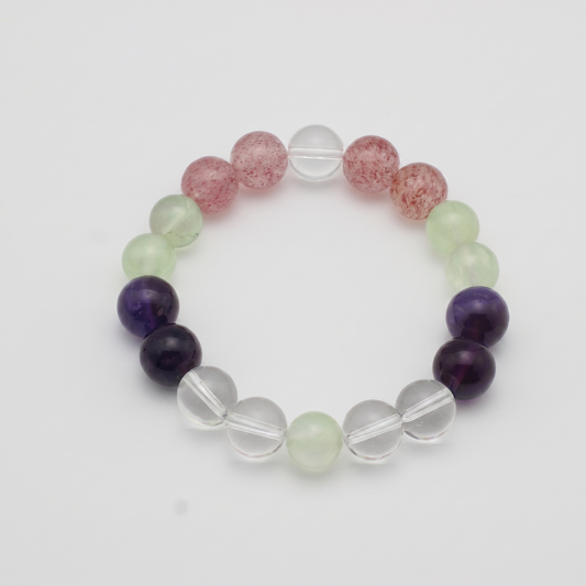 Verdant Blush bracelet by Krysora - Prehnite, Strawberry Quartz and Uruguayan Amethyst with Clear Quartz accents, verdant green and warm pink-red palette, product photo on white background