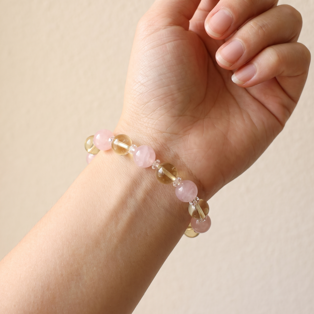 Golden Harvest on a wrist — citrine's honeyed glow beside rose quartz's blush.