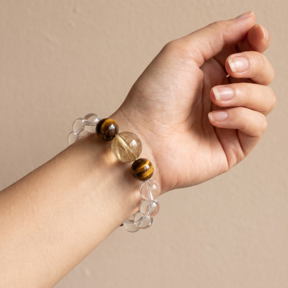 Gilded Silk bracelet by Krysora worn on a woman's wrist - champagne gold and warm clay beads with soft silk-white rutile
