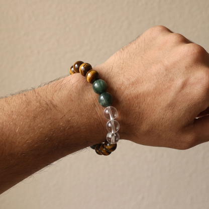 Verdant Bronze bracelet by Krysora worn on a man's wrist - verdant green rutilated quartz with golden-brown tiger's eye