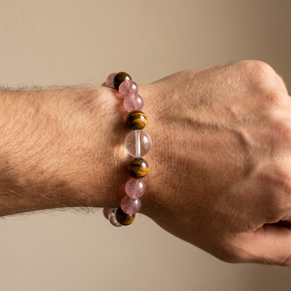 Tawny Blush bracelet by Krysora worn on a man's wrist - warm tiger's eye with soft strawberry pink