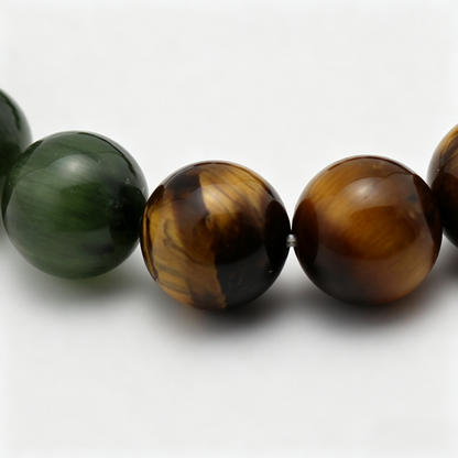 Close-up of the Verdant Bronze bracelet by Krysora - bead detail, green rutilated quartz, tiger's eye, natural markings