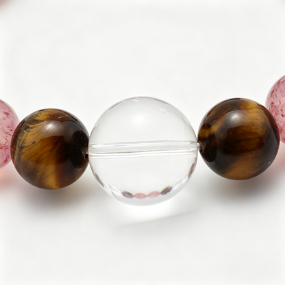 Close-up of the Tawny Blush bracelet by Krysora - bead detail, tiger's eye, strawberry quartz, natural markings