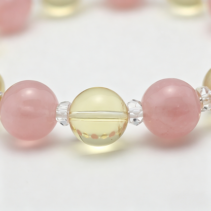 Golden Harvest bead detail — citrine and rose quartz, natural markings up close.