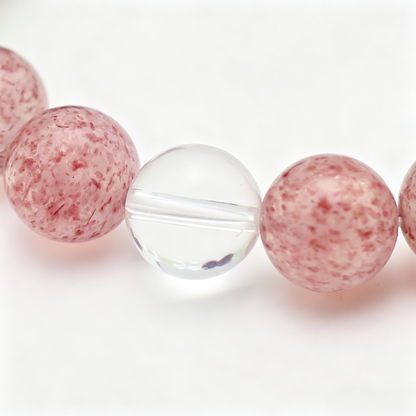 Close-up of the Verdant Blush bracelet by Krysora - bead detail, prehnite, strawberry quartz, natural markings