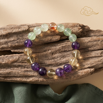 Tri-Cultivate bracelet by Krysora in a brand scene - a red, gold and green three-tone gemstone bracelet