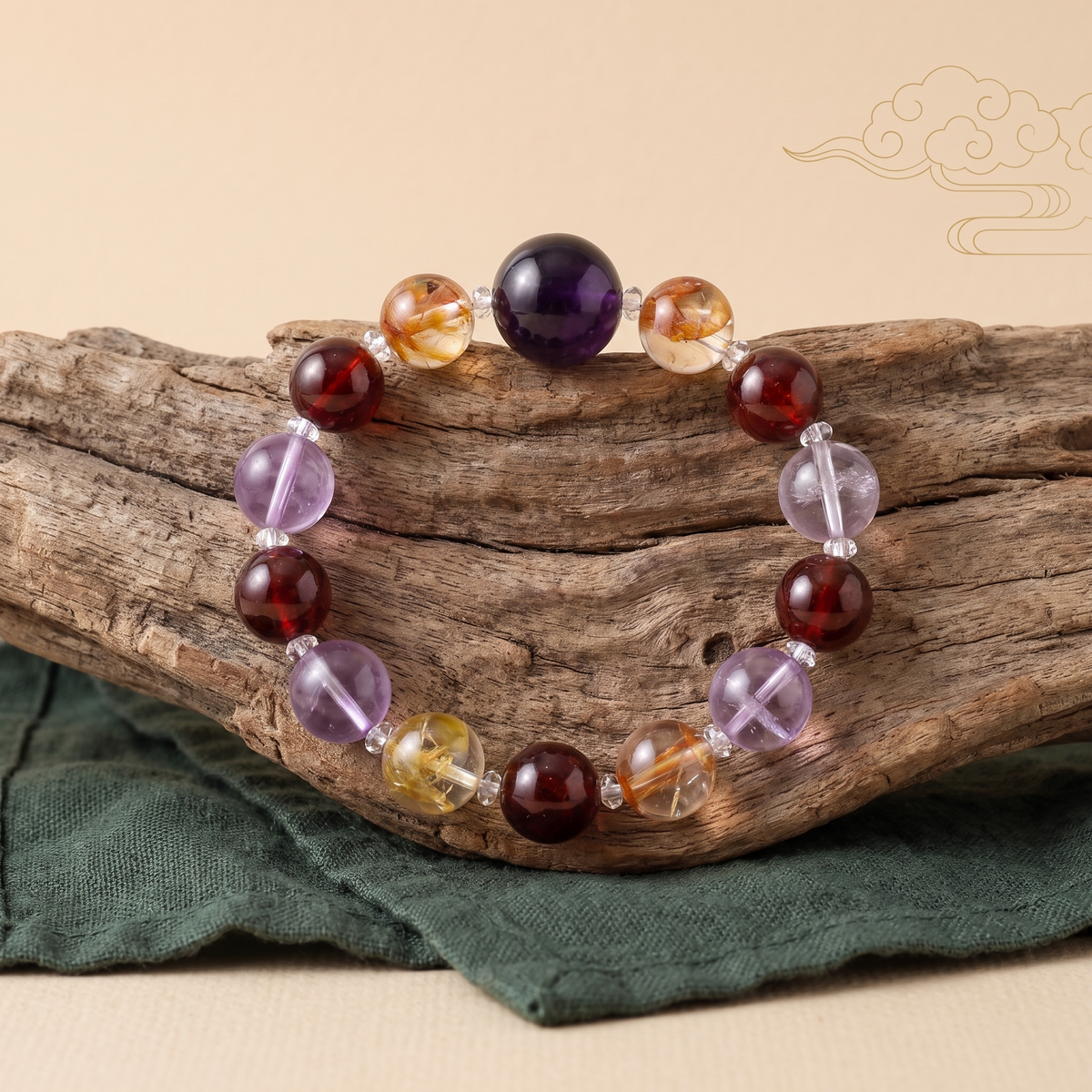 Southern Flame bracelet by Krysora in a brand scene -- warm purple-red amethyst, garnet and hematoid quartz beads, styled in natural daylight.