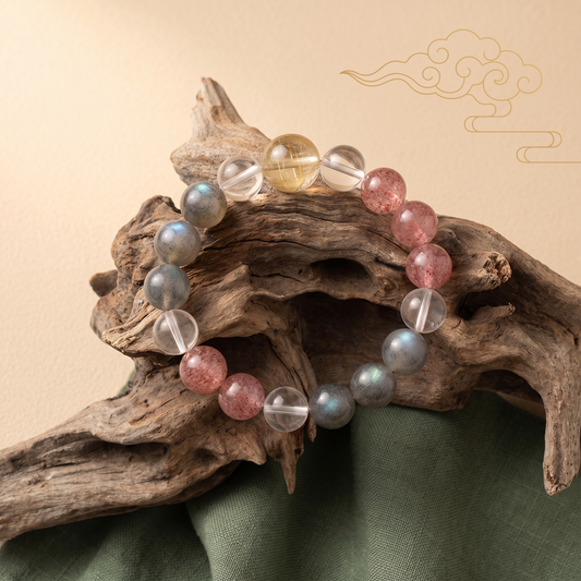 Gilded Blush bracelet by Krysora in a brand scene - golden, pink and clear with a cool blue-gray shimmer, a warm gemstone bracelet