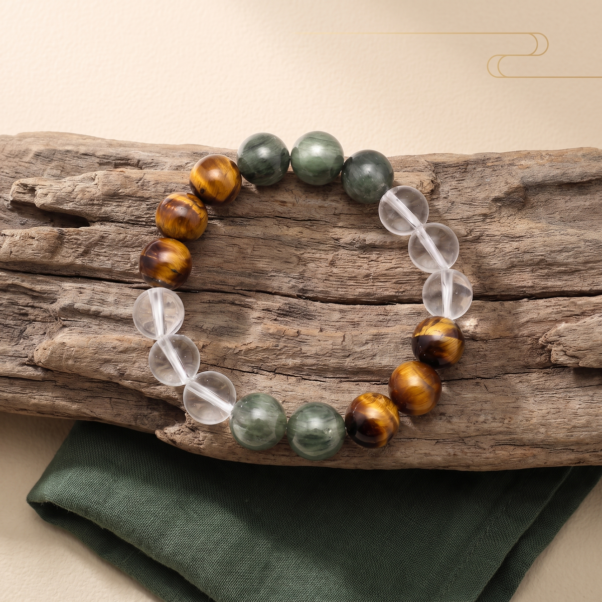 Verdant Bronze bracelet by Krysora in a brand scene - verdant green, golden-brown and clear, a warm gemstone bracelet