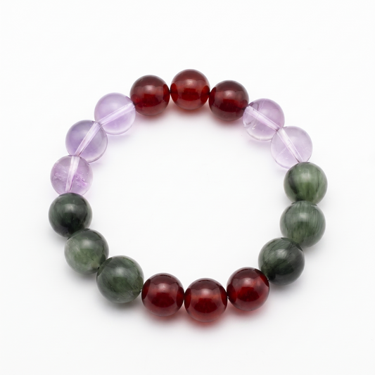 Verdant Spark bracelet by Krysora - Green Rutilated Quartz, Brazilian Amethyst and Garnet beads, sprouting green and warm ember palette, product photo on white background