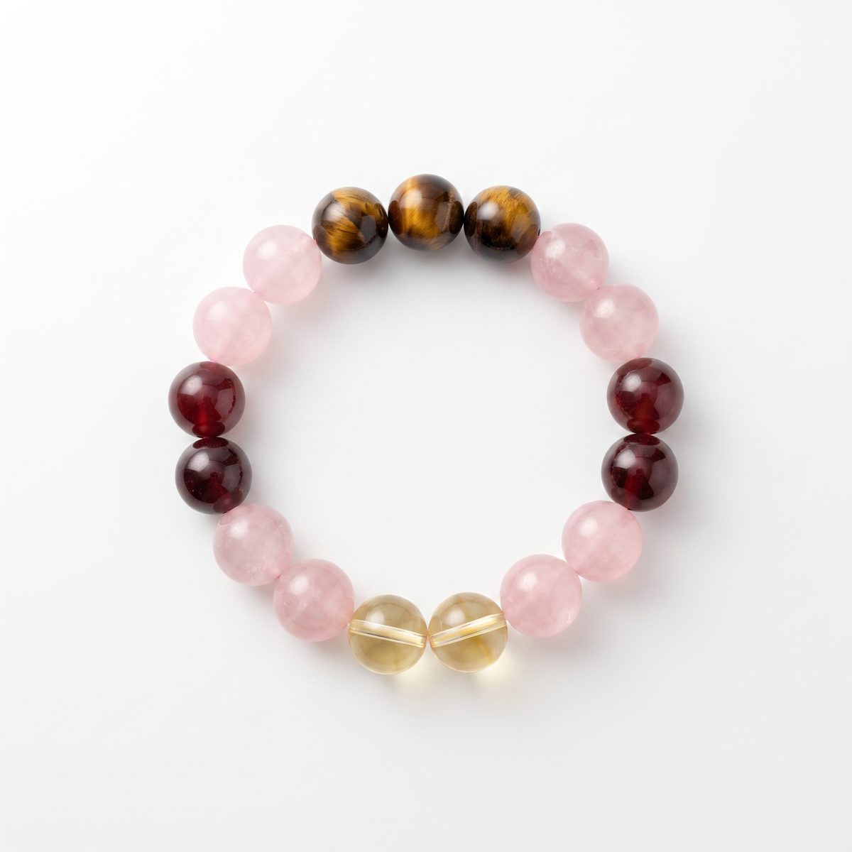 Ember Bloom bracelet by Krysora - Rose Quartz, Tiger's Eye, Garnet and Citrine beads, soft pink warm red and settled clay palette, product photo on white background