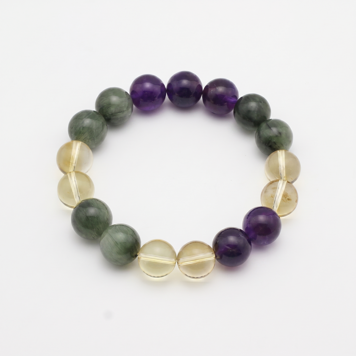 Verdant Flame bracelet by Krysora - Green Rutilated Quartz, Uruguayan Amethyst and Citrine beads, fresh spring green with warm clay-gold palette, product photo on white background