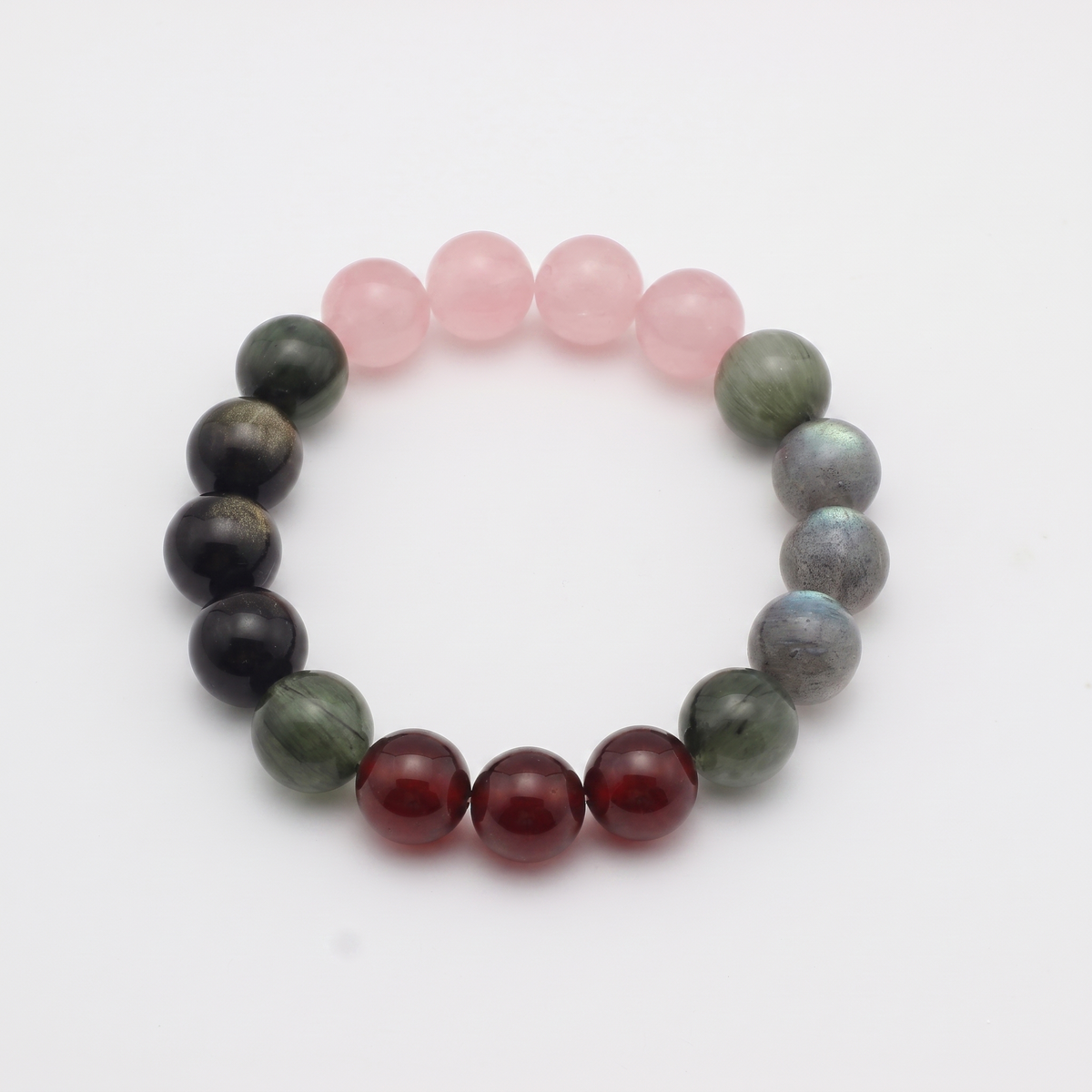 Aqua Ember bracelet by Krysora - Golden Sheen Obsidian, Rose Quartz and Garnet beads with Green Rutilated and Gray Labradorite accents, deep ink and warm ember palette, product photo on white background