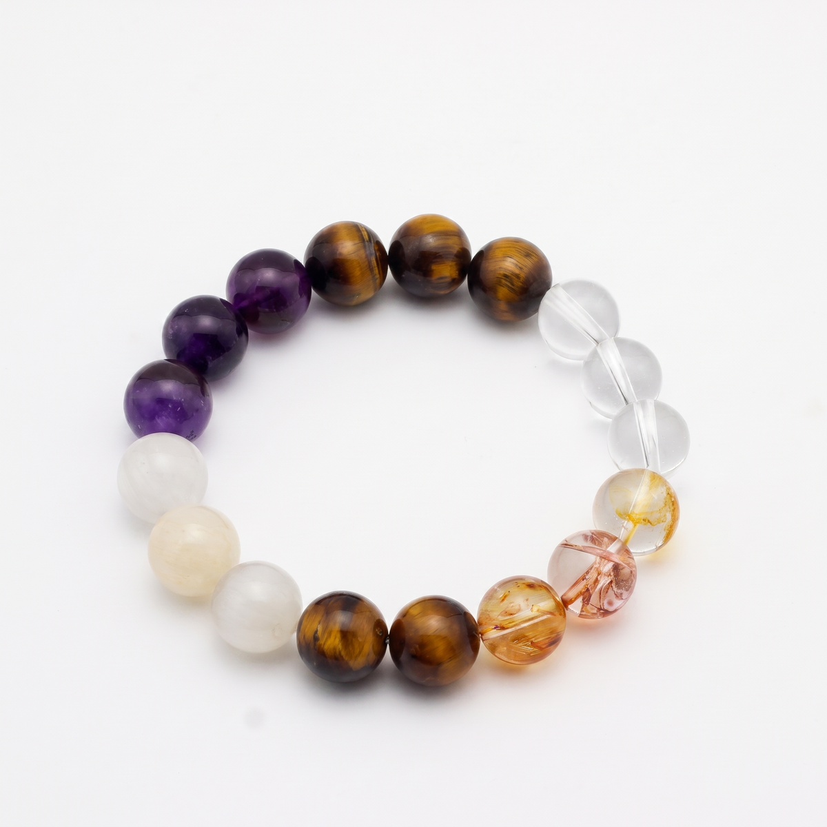 Ember Gold bracelet by Krysora - Tiger's Eye, Red Hematoid Quartz and Uruguayan Amethyst beads with White Rutilated and Clear Quartz accents, warm clay and warm ember palette, product photo on white background