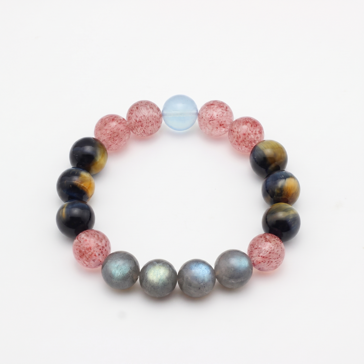 Tri-Sheen bracelet by Krysora - clear blue Aquamarine, warm ochre Tiger's Eye, berry-red Strawberry Quartz, product photo on white background